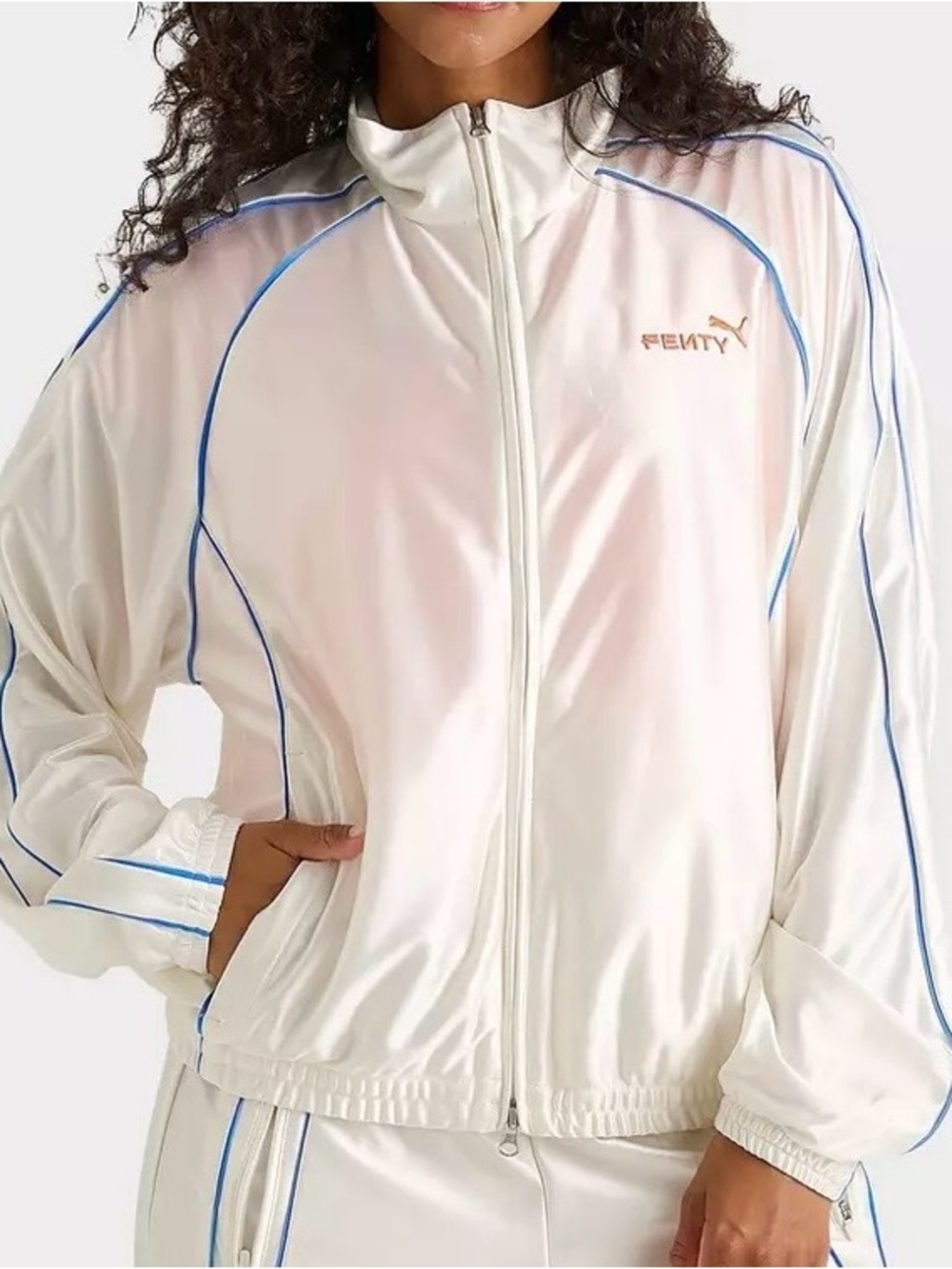 Fenty x Puma T7 Track Jacket in a warm white color. Womens/Unisex